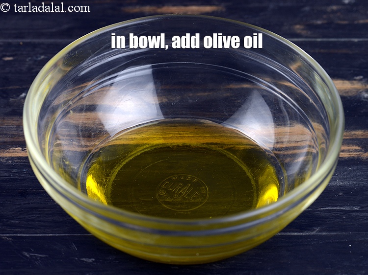 Step 3 – In a small bowl, add 2 tbsp <a href="https://www.tarladalal.com/glossary-olive-oil-451i">olive oil</a>.