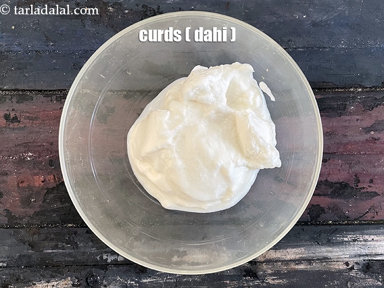 Step 16 – In a bowl put&nbsp;<meta charset="UTF-8" />1/2 cup&nbsp;<a href="glossary-curd-dahi-yogurt-yoghurt-383i">curds (dahi)</a>.