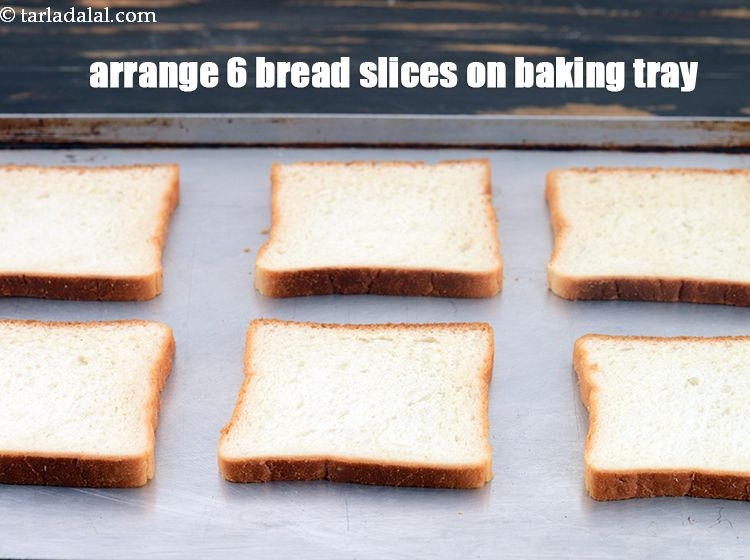 Step 3 – Arrange 6&nbsp;<a href="https://www.tarladalal.com/glossary-bread-219i">bread slices</a> on a baking tray.