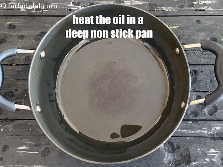 Step 9 – Heat 2 tsp oil in a deep non-stick pan.