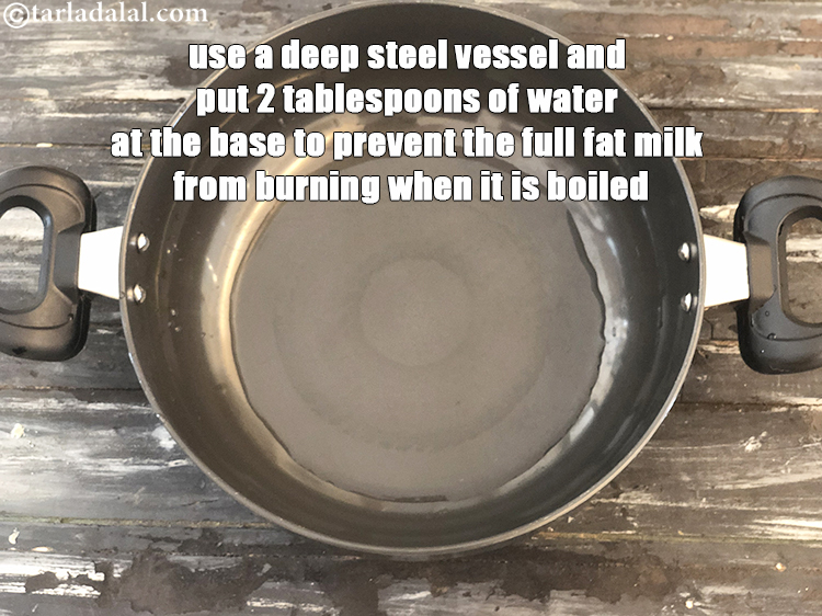 Step 2 – To make&nbsp;<strong>homemade skimmed milk</strong>, use a deep steel vessel and put 2 tablespoons of water …