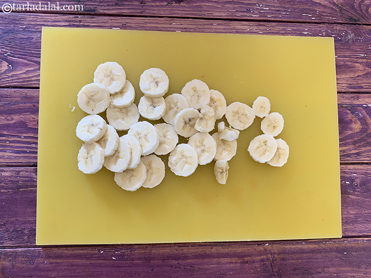 Step 3 – Using a knife, cut the banana into slices of medium thickness. Do not cut the …