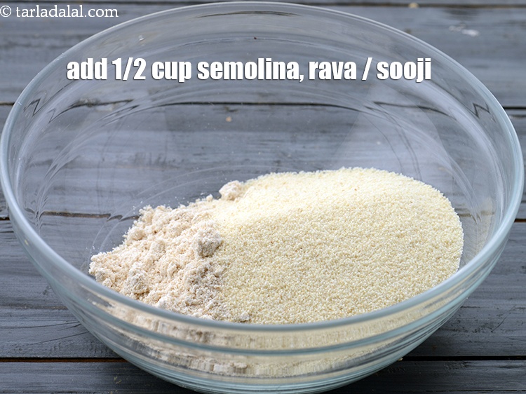 Step 12 – Add the 1/2 cup&nbsp;<a href="https://www.tarladalal.com/glossary-semolina-sooji-rava-rawa-603i">semolina (rava / sooji)</a>.