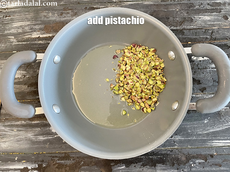 स्टेप 6 – 1/3 कप मोटे&nbsp;&nbsp;<a href=""https://www.tarladalal.com/glossary-chopped-pistachios-893i"" style=""font-family:Arial; font-size:16px; font-style:normal; font-variant-ligatures:normal; font-weight:400; text-align:left; …