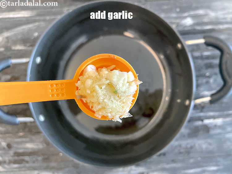Step 15 – Add&nbsp;<meta charset="UTF-8" />1 tsp&nbsp;finely&nbsp;<a href="glossary-chopped-garlic-790i">chopped garlic (lehsun)</a>.