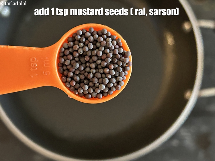 Step 5 – Add&nbsp;<meta charset="UTF-8" />1 tsp&nbsp;<a href="glossary-mustard-seeds-sarson-rai-sarson-ke-beej-525i">mustard seeds ( rai / sarson)</a>.