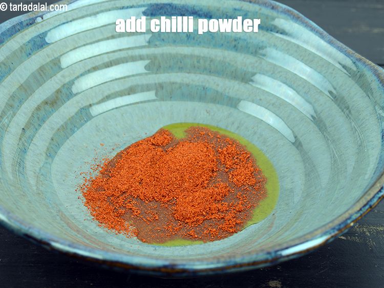 Step 4 – Add 1 &frac12; tsp <a href="https://www.tarladalal.com/glossary-chilli-powder-red-chilli-powder-339i">chilli powder</a>.