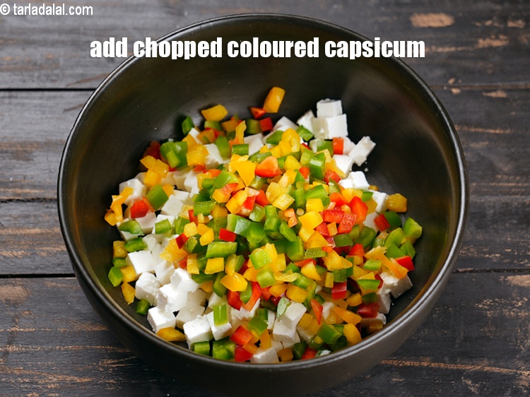 Step 5 – Add 6 tbsp <a href="https://www.tarladalal.com/glossary-chopped-coloured-capsicum-2800i">chopped coloured capsicum</a>.