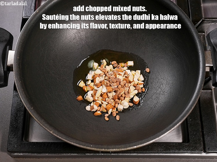 Step 5 – <p>Add ¼ cup&nbsp;<a href="https://www.tarladalal.com/glossary-chopped-mixed-nuts-928i">chopped mixed nuts</a>. Sautéing the nuts elevates the dudhi ka halwa by …