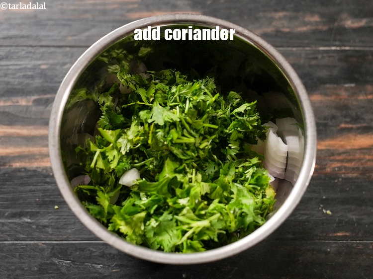 Step 5 – Add &frac14; cup <a href="https://www.tarladalal.com/glossary-chopped-coriander-783i">chopped coriander (dhania)</a>.
