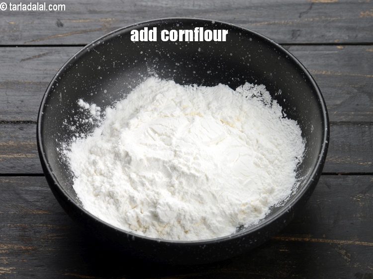 Step 5 – Add &frac14; cup <a href="https://www.tarladalal.com/glossary-cornflour-cornstarch-maize-starch-corn-flour-112i">cornflour</a>.
