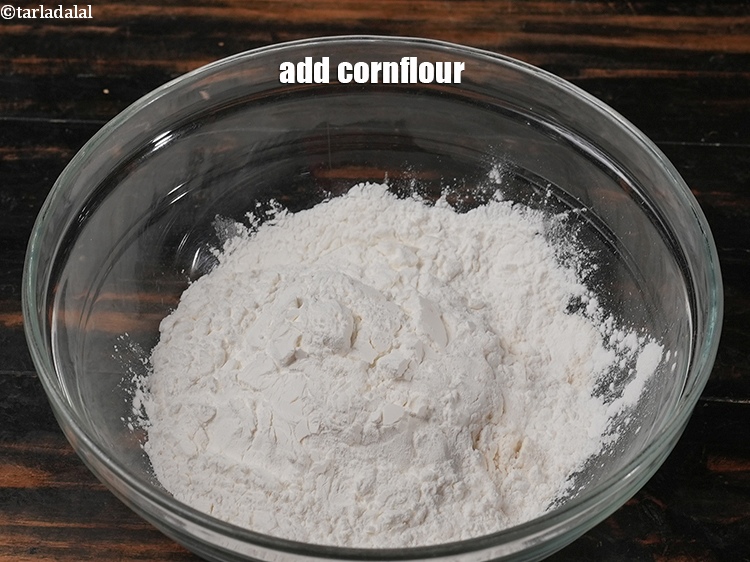 Step 4 – Add &frac12; cup <a href="https://www.tarladalal.com/glossary-cornflour-cornstarch-maize-starch-corn-flour-112i">cornflour</a>.
