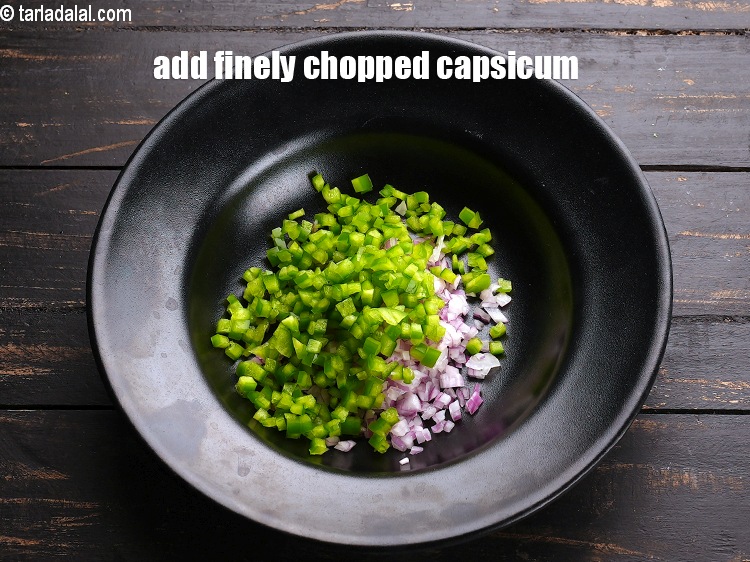 Step 4 – Add &frac14; cup finely <a href="https://www.tarladalal.com/glossary-chopped-capsicum-164i">chopped capsicum</a>.