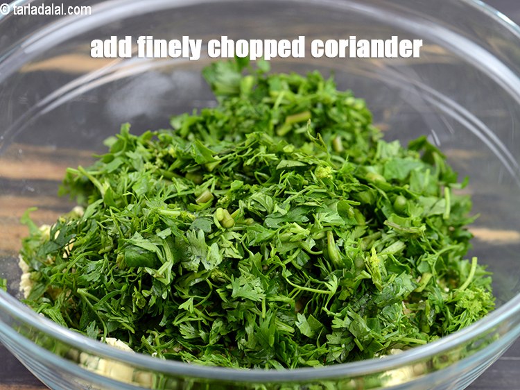 Step 4 – Add 1 cup finely <a href="https://www.tarladalal.com/glossary-chopped-coriander-783i">chopped coriander (dhania)</a>.