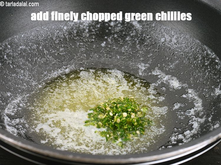 Step 4 – Add 2 tsp finely <a href="https://www.tarladalal.com/glossary-chopped-green-chilli-820i">chopped green chillies</a>.&nbsp;