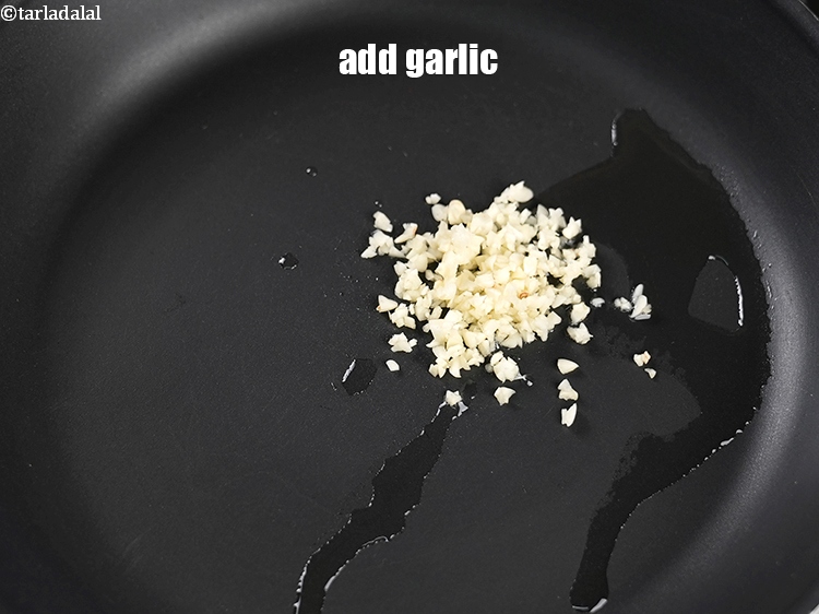 Step 6 – Add 1 tbsp finely&nbsp;<a href="https://www.tarladalal.com/glossary-chopped-garlic-790i">chopped garlic (lehsun)</a>.