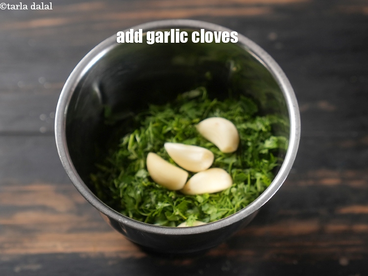 Step 4 – Add 5 <a href="https://www.tarladalal.com/glossary-garlic-cloves-1857i">garlic (lehsun) cloves</a>.