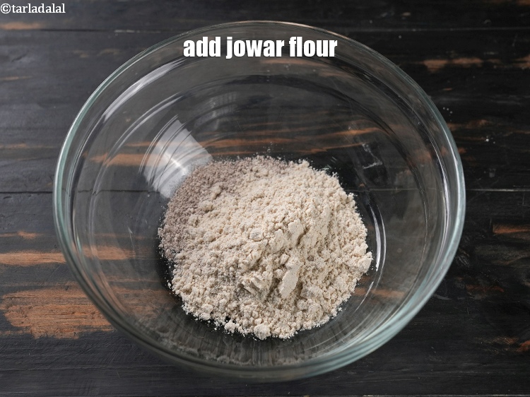 Step 4 – Add &frac14; cup&nbsp;<a href="https://www.tarladalal.com/glossary-jowar-flour-jowar-ka-atta-white-millet-flour-sorghum-flour-483i">jowar (white millet) flour</a>.