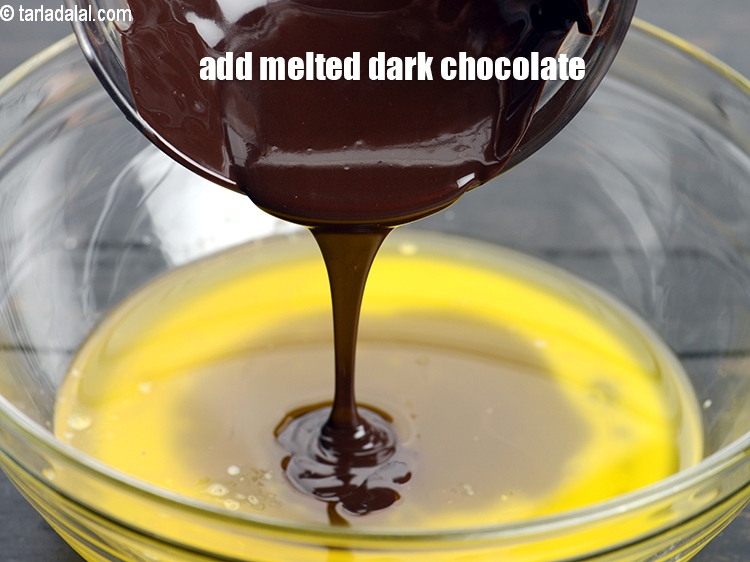 Step 5 – Add &frac12; cup&nbsp;<a href="https://www.tarladalal.com/glossary-melted-dark-chocolate-2477i">melted dark chocolate</a>. We have used 1 &frac14; cup of chopped dark …