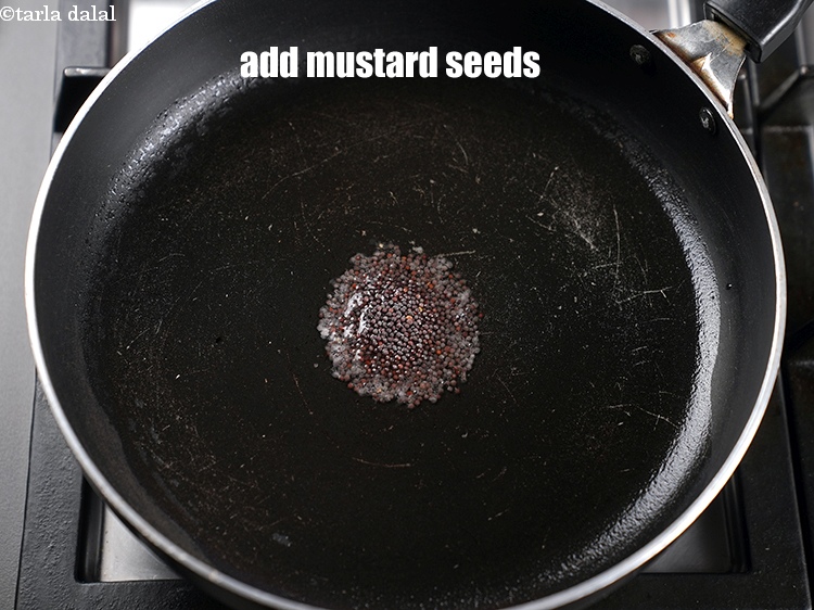 Step 9 – Add 1 tsp <a href="https://www.tarladalal.com/glossary-mustard-seeds-sarson-rai-sarson-ke-beej-525i">mustard seeds ( rai / sarson)</a>.
