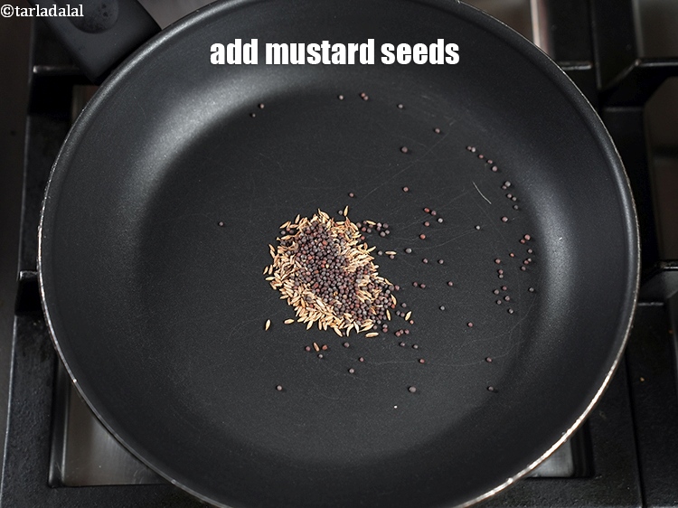 Step 4 – Add &frac12; tsp <a href="https://www.tarladalal.com/glossary-mustard-seeds-sarson-rai-sarson-ke-beej-525i">mustard seeds ( rai / sarson)</a>.