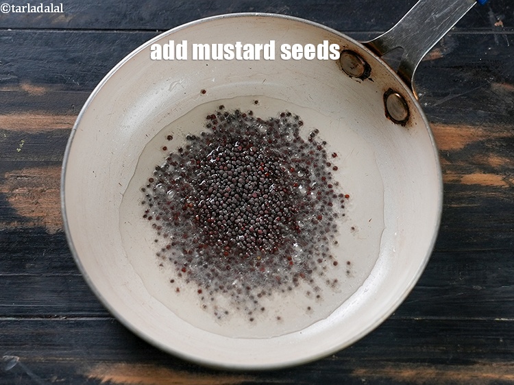 Step 4 – Add 1 tsp <a href="https://www.tarladalal.com/glossary-mustard-seeds-sarson-rai-sarson-ke-beej-525i">mustard seeds ( rai / sarson)</a>.
