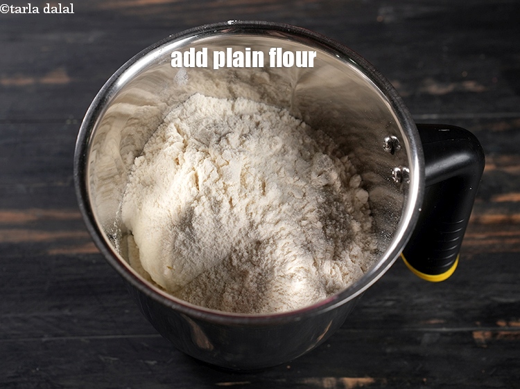Step 16 – Add &frac34; cup <a href="https://www.tarladalal.com/glossary-plain-flour-maida-188i">plain flour (maida)</a>.