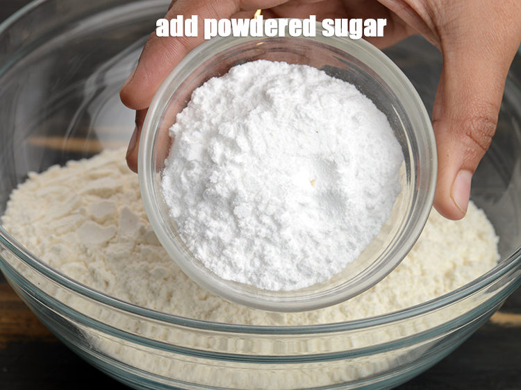 Step 4 – Add &frac12; cup <a href="https://www.tarladalal.com/glossary-powdered-sugar-280i">powdered sugar</a>.