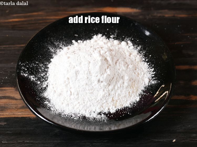 Step 4 – Add &frac14; cup <a href="https://www.tarladalal.com/glossary-rice-flour-chawal-ka-atta-534i">rice flour (chawal ka atta)</a>.