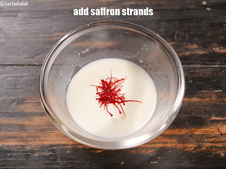 Step 4 – Add &frac14; tsp <a href="https://www.tarladalal.com/glossary-saffron-kesar-520i">saffron (kesar) strands</a>.&nbsp;