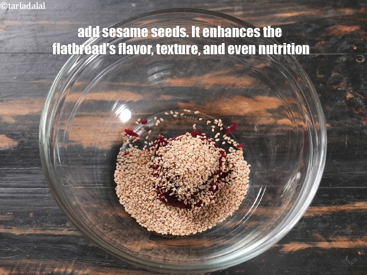 Step 4 – Add 1 tbsp <a href="https://www.tarladalal.com/glossary-sesame-seeds-til-gingelly-seeds-612i">sesame seeds (til)</a>. The tiny sesame seeds embedded in the roti …