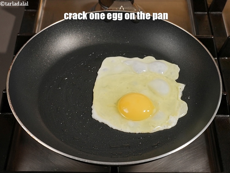 Step 4 – Crack one egg on the pan.