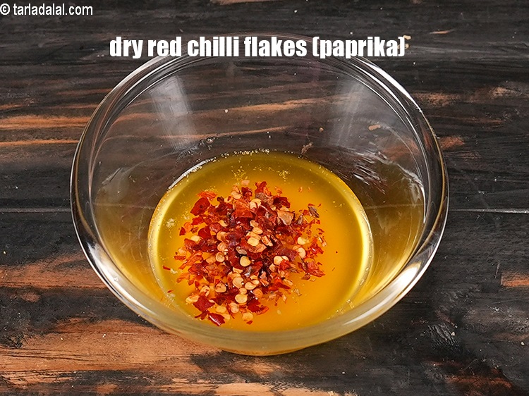 Step 7 – Add&nbsp;1/2 tsp&nbsp;<a href="https://www.tarladalal.com/glossary-dry-red-chilli-flakes-paprika-338i">dry red chilli flakes (paprika)</a>.