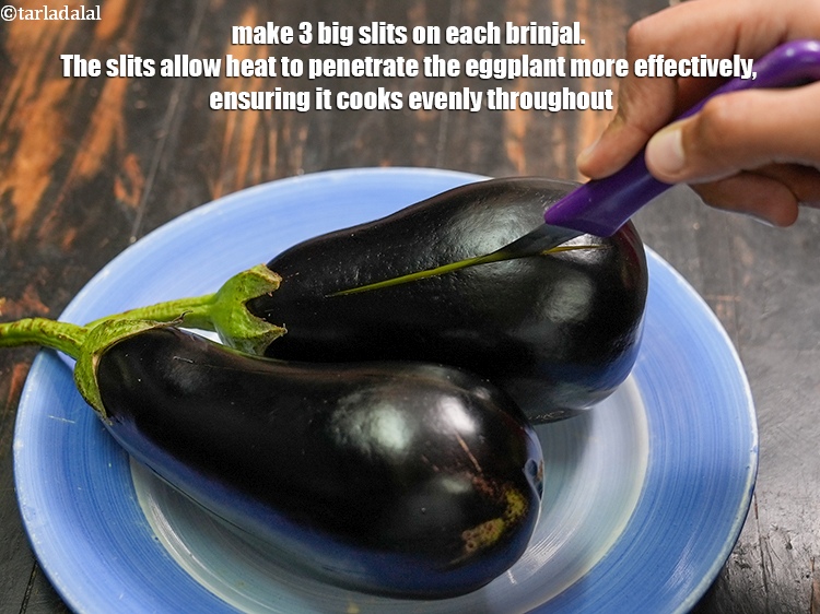 Step 4 – Make 3 big slits on each brinjal. The slits allow heat to penetrate the eggplant …
