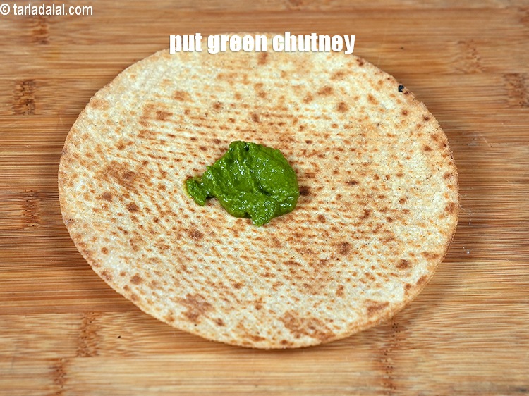 Step 4 – Put 1 tsp <a href="https://www.tarladalal.com/green-chutney-22266r">green chutney</a>.