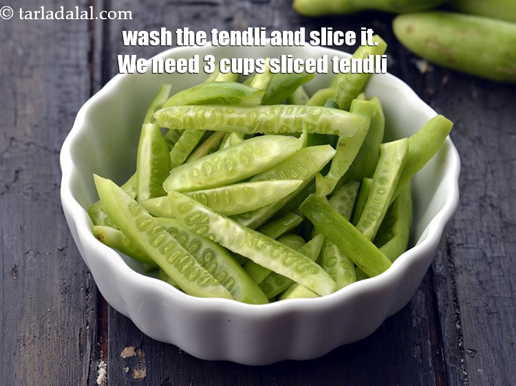 Step 4 – Wash the tendli and slice it. We need&nbsp;3 cups&nbsp;<a href="https://www.tarladalal.com/glossary-sliced-tendli-1161i">sliced tendli</a>. Keep aside.&nbsp;