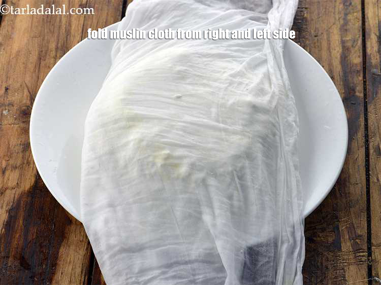 Step 31 – Give a proper shape to the paneer with your hand.&nbsp;<meta charset="UTF-8" />Fold it from right …