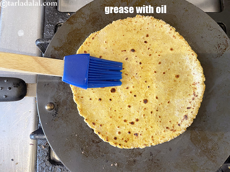 Step 27 – Grease again the top with little oil and cook for 10 to 15 seconds.