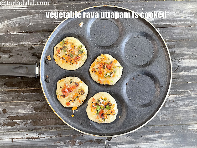 Step 33 – Flip over and cook both sides till golden brown. Your vegetable sooji uttapam is ready.