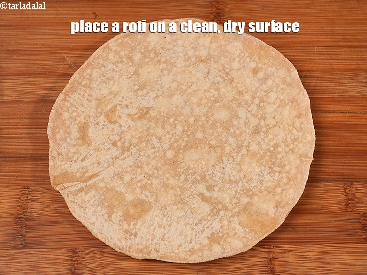 Step 29 – <meta charset="UTF-8" />Place a roti on a clean dry surface&nbsp;