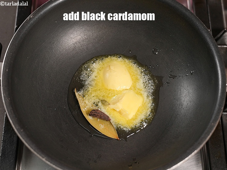 Step 22 – Add 1 <a href="https://www.tarladalal.com/glossary-black-cardamom-badi-elaichi-moti-elaichi-263i">black cardamom (badi elaichi)</a>.