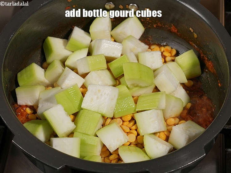 Step 23 – Add 2 cups <a href="https://www.tarladalal.com/glossary-bottle-gourd-cubes-1336i">bottle gourd (doodhi / lauki) cubes</a>.