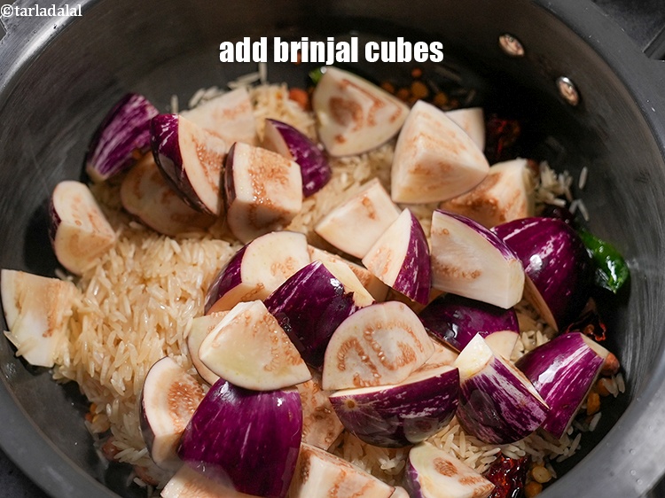 Step 22 – Add 1&frac12; cups <a href="https://www.tarladalal.com/glossary-brinjal-cubes-132i">brinjal (baingan / eggplant) cubes</a>.&nbsp;