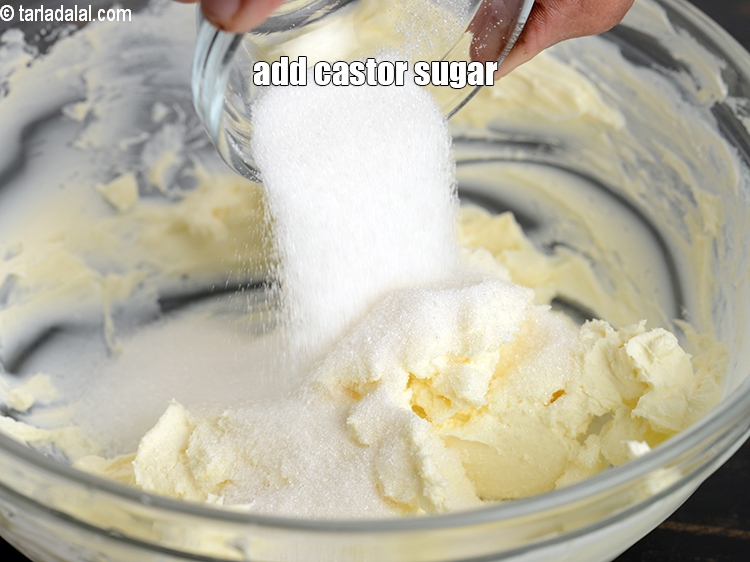Step 23 – Add &frac14; cup <a href="https://www.tarladalal.com/glossary-castor-sugar-279i">castor sugar</a>.