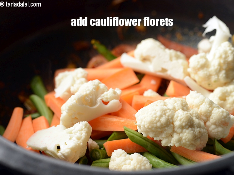 Step 22 – Add 1 cup <a href="https://www.tarladalal.com/glossary-cauliflower-florets-753i">cauliflower florets</a>.