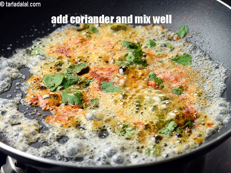 Step 22 – Add 1 tbsp finely <a href="https://www.tarladalal.com/glossary-chopped-coriander-783i">chopped coriander (dhania)</a>&nbsp;and mix well for 30 seconds.