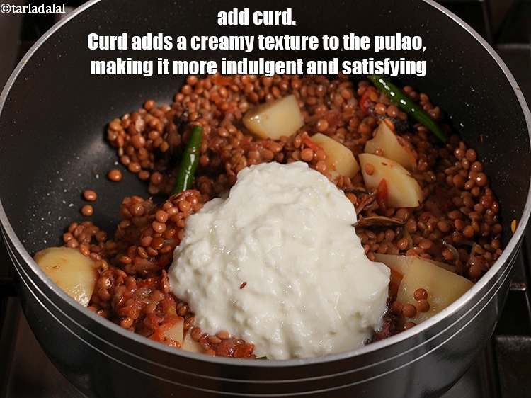 Step 22 – Add &frac12; cup <a href="https://www.tarladalal.com/glossary-curd-dahi-yogurt-yoghurt-383i">curd (dahi)</a>. Curd adds a creamy texture to the pulao, making …