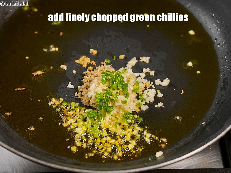 Step 22 – Add 1 tsp finely <a href="https://www.tarladalal.com/glossary-chopped-green-chilli-820i">chopped green chillies</a>.&nbsp;