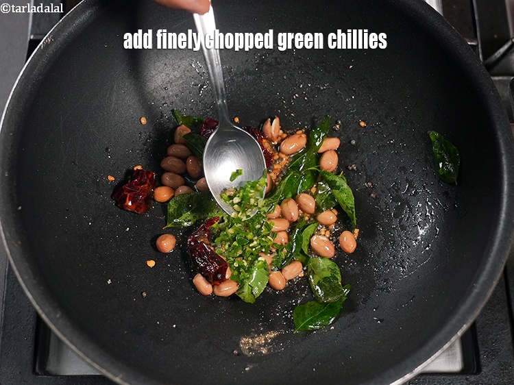 Step 22 – Add 1 tsp finely <a href="https://www.tarladalal.com/glossary-chopped-green-chilli-820i">chopped green chillies</a>.&nbsp;