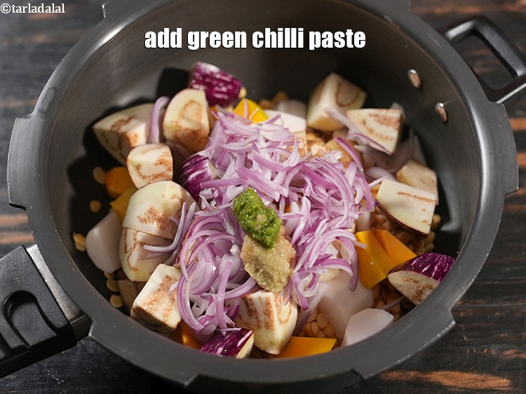 Step 22 – Add 1 tsp <a href="https://www.tarladalal.com/glossary-green-chilli-paste-hari-mirch-ki-paste-mirchi-paste-333i">green chilli paste</a>.